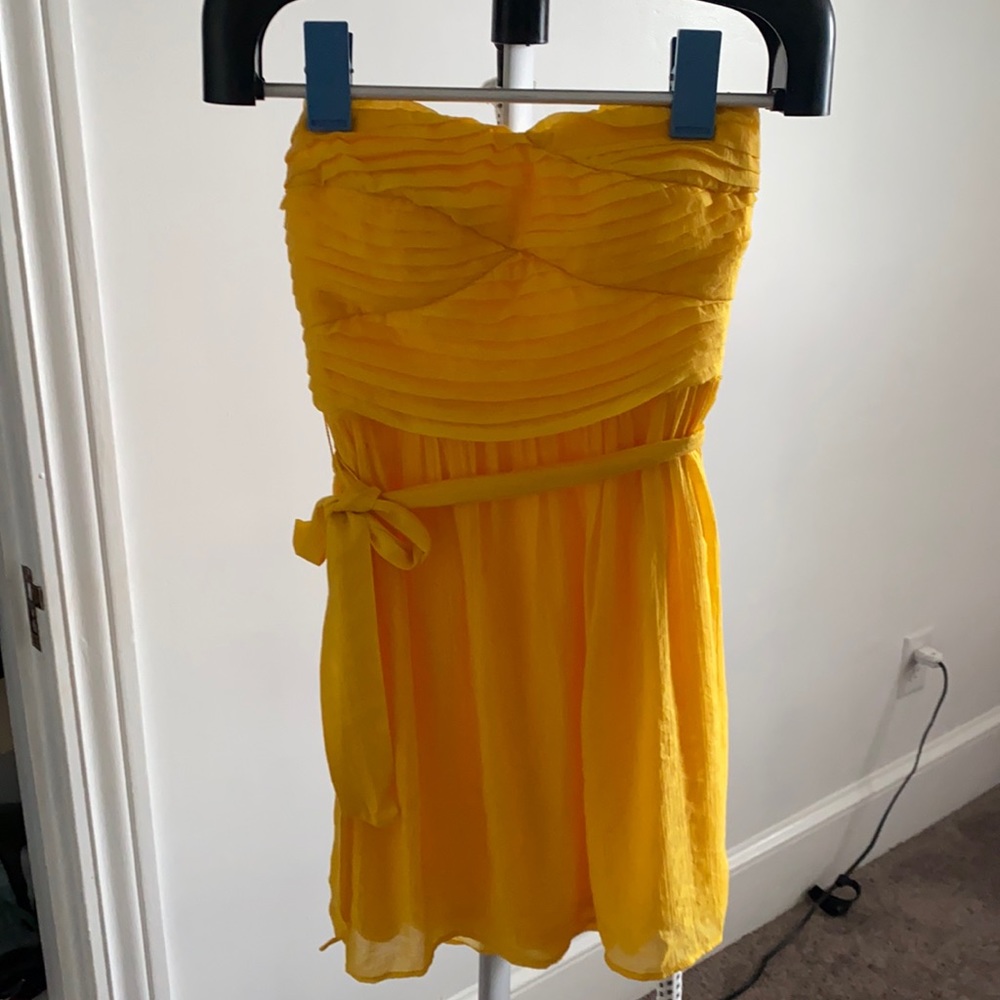 Strapless yellow ruffled dress